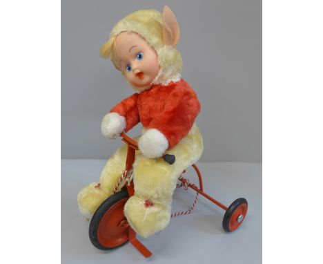 A vintage 1950's Chiltern Toys Pixie on a Trike doll, boxed 