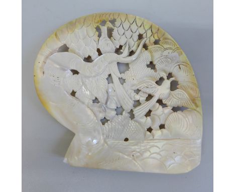 A carved mother of pearl shell dish 