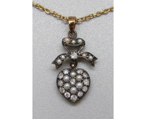 A pearl and diamond pendant on a yellow metal chain, 4.4g 