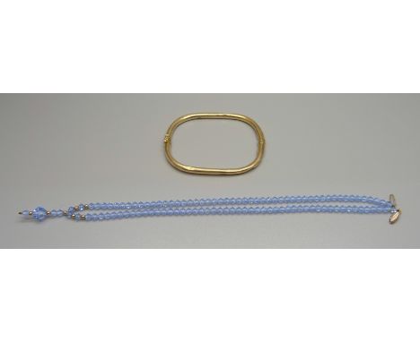 A 9ct gold bangle, a/f, 4.3g, and a crystal necklet with 9ct gold fastener and bead decoration 