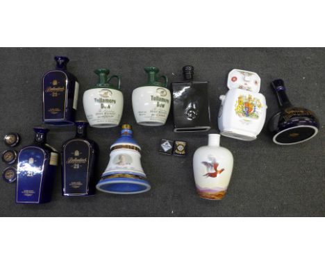 A collection of Wade including Ballantyne's Old Scotch Whisky, lids lacking corks, Tullamore Dew Irish Whiskey, some bottles 