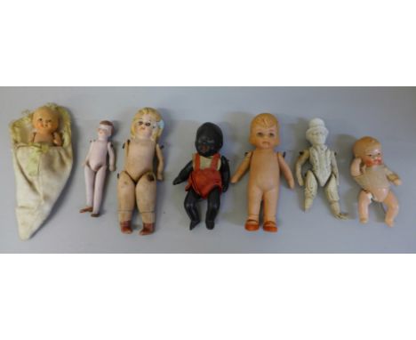 Seven small antique all bisque dolls, largest 10cm 