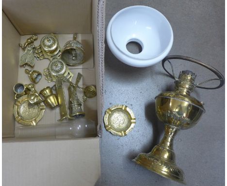 A collection of brassware including an oil lamp **PLEASE NOTE THIS LOT IS NOT ELIGIBLE FOR POSTING AND PACKING** 