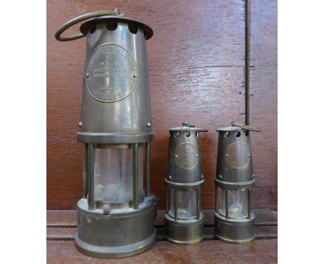 An Eccles Type 6 miner's lamp and two smaller 
