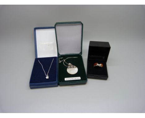 Two silver pendants on chains including one set with mother of pearl and an amber set silver ring, L 
