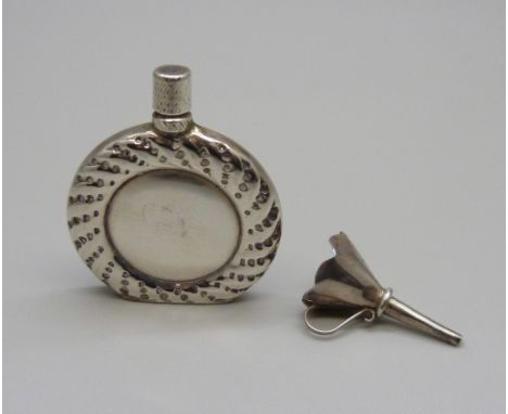 A small silver scent flask and funnel 