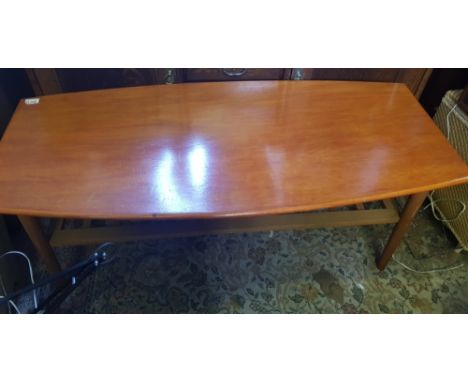 Mid century modern teak coffee table with magzine shelf rack below 