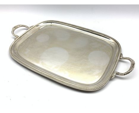 Silver rectangular two handled tray with gadrooned edge and floral handles 57cm x 34cm overall, Sheffield 1971 Maker E H Park