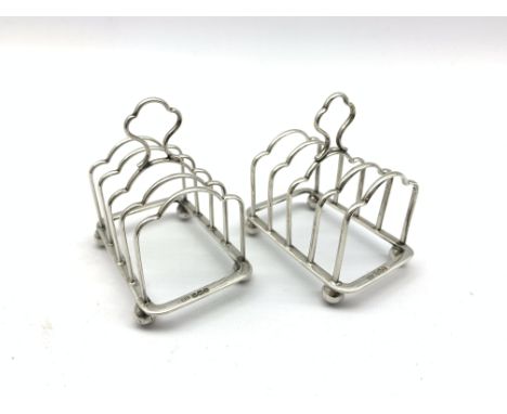 Pair of small silver four division toast racks with loop handles and ball feet L5.5cm Sheffield 1919 Maker Atkin Bros.2.4oz C