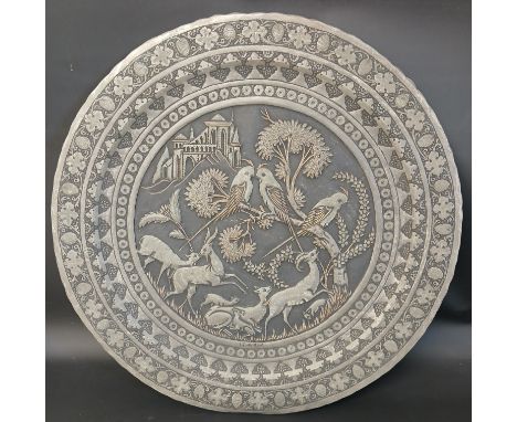 Persian metal plate / wall art featuring engraved animals and trees, signed, 48cm dia