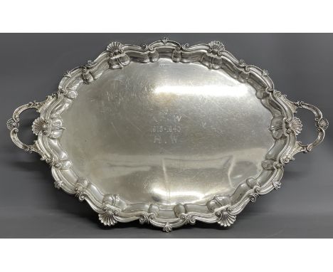 Large silver two handled tray in the rococo style, engraved centre, 126ozt by Walker &amp; Hall Sheffield with worn hallmark 