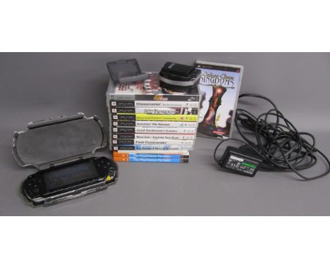 Sony PSP with Logitech protective case, spare battery and charger, 9 games including Chess, Sudoku,Hits Remixed, 1 x UMV, ins