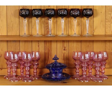 A set of ten pink tinted hock glasses, 19cm high; a set of six cut-glass wines each with a ruby bowl &amp; on a knapped stem 