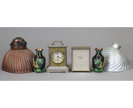 A 1970’s Garrard 8-day mantel clock in a brass case, 14cm high; together with another mantel clock, 15cm high; a pair of cloi