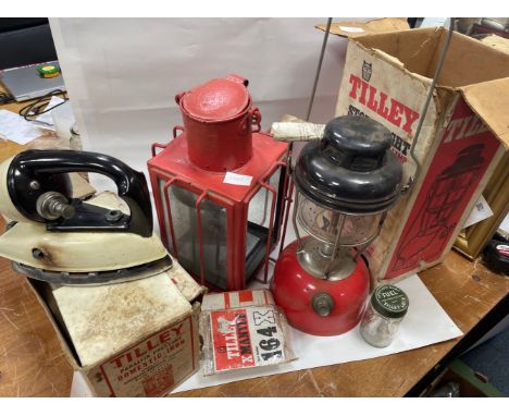 A TILLEY STORMLIGHT X246B in original box with mantles, a boxed TILLEY paraffin pressure DOMESTIC IRON and a further hanging 