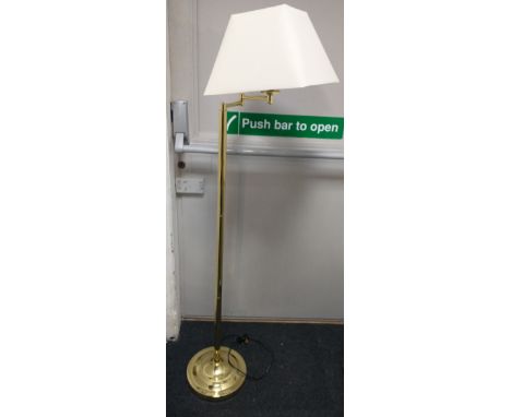 Brass style standard lamp with shade on adjustable arm. Approx 1.4m tall including shade