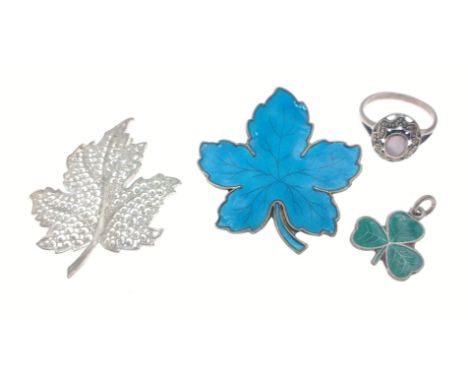 A small silver lot comprising 2 Canadian maple leaf brooches, one Danish silver blue enamel, the other German silver filigree