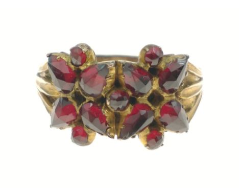 STUNNING! An UNMARKED yellow metal floral design red stone set ring Size U, gross weight 3.45gApprox 1 pieces
