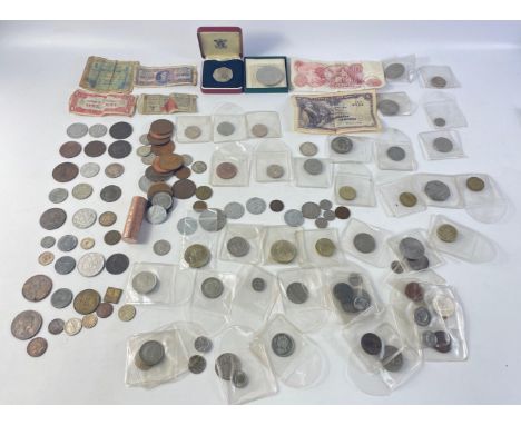 A mixed collection of coins in plastic holders to include from the Netherlands, Sweden and Spain, also various UK coins inclu