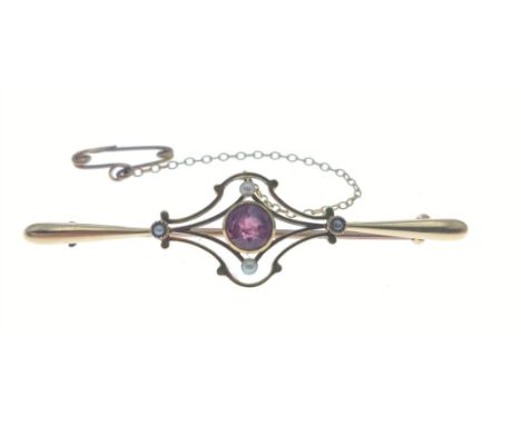 A vintage bar brooch stamped 15ct set with 4 seed pearls and a central pink stone with safety chain, 5cm long, gross weight 3