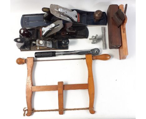 A selection of hand tools including a 3/8 torque wrench, an old-fashioned saw and 5 planes