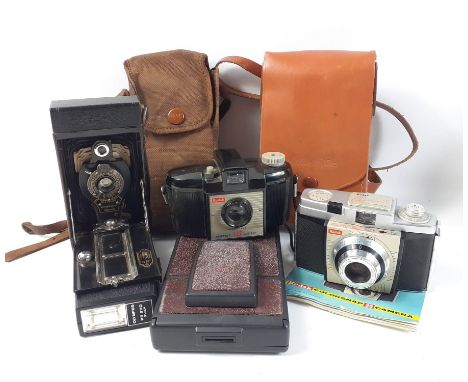 A collection of vintage cameras to include A KODAK Brownie 127, a KODAK ColorSnap 35, a POLAROID SX-70 land camera model 2 (p