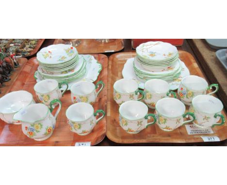 Royal Albert 'Crown China' part tea set, transfer printed and hand painted with blue and yellow flowers.  Rims edged in green