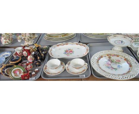 Three trays of assorted china to include: Limoges porcelain charger with hand painted flowers to the centre and a reticulated