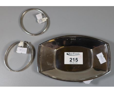 A silver rectangular dish.  Approx weight 3 grams Together with a silver and a white metal bangle.(B.P. 21% + VAT) 