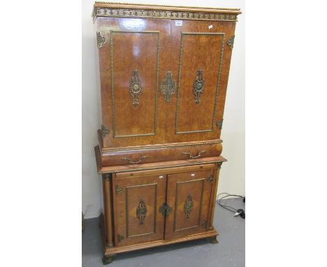 Reproduction walnut two stage cabinet in the French taste with metal mounts, two frieze drawers under two cupboard doors with