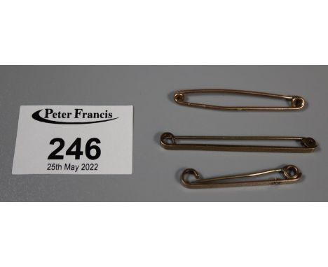 Two 9ct gold tie pins and a yellow metal tie pin (3).  Approx weight 5.4 grams.(B.P. 21% + VAT) 