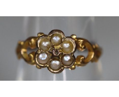 A Victorian yellow metal pearl set posy ring.  Ring size M.  Approx weight 1.3 grams. (B.P. 21% + VAT) 