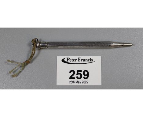 A silver pencil with engine turned pencil.(B.P. 21% + VAT) 