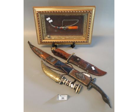 Group of three assorted Eastern daggers, one in framed display case, together with a modern hardwood handled bowie knife in l