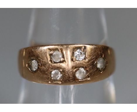 A 9ct rose gold ring set with white stones.  Ring size K.  Approx weight 2 grams.  (B.P. 21% + VAT) 