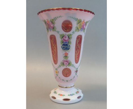 A Bohemian overlay glass flared vase overall with ruby and gilt hand painted floral and foliate decoration, bearing label 'Bo