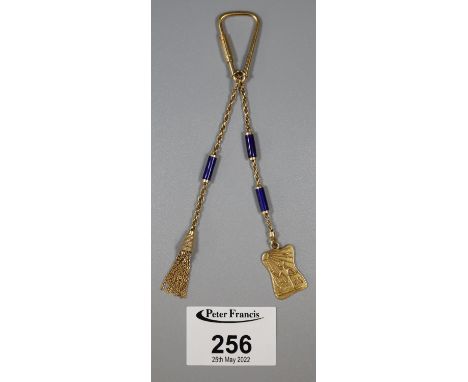 An 18ct gold pendant brooch with key ring style clip. The gold pendant and tassel suspended from gold chain with deep blue en