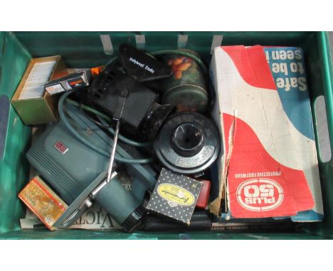 Box of photographic equipment to include: Argus 200 slide projector, slides of fish , landscapes, family members etc.  Ferran