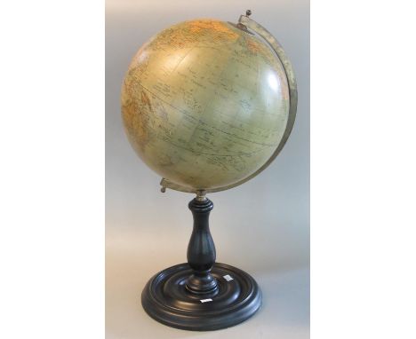 Modern terrestrial globe on moulded wooden stand. Overall 58cm high approx. (B.P. 21% + VAT) Wear to the base , some scratche