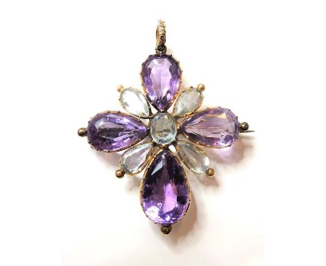 An early/mid-19th century amethyst and aquamarine brooch/pendant, of elongated cruciform design, set with a pendeloque amethy
