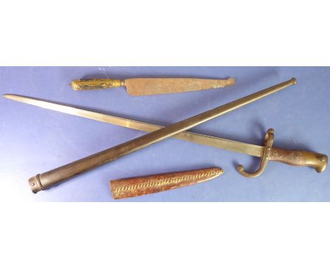 A French Model 1874 Gras bayonet and a North African dagger; the bayonet with Chatellerault Armoury 1876 marking and the dagg