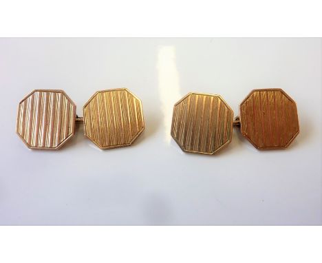 A pair of 9-carat yellow-gold octagonal plaque cufflinks; engine-turned decoration and chain link connections (combined gross