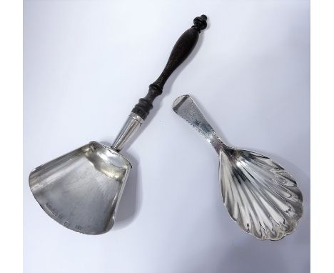 A late Georgian (hallmarked London 1794) silver caddy spoon and a white-metal example, the latter with turned fruitwood handl