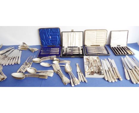 A large quantity of mostly late 19th/and early 20th century flatware and cutlery: 29 hallmarked silver-handled knives with en