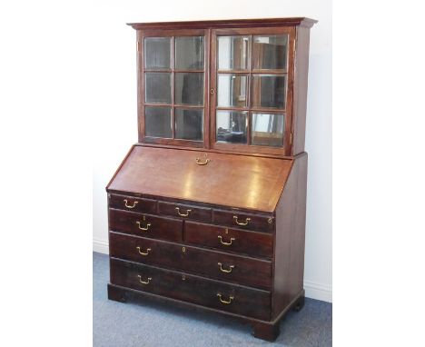 A very well-made 18th century style (later) Anglo-Indian rosewood bureau cabinet; the outset cornice above two glazed doors, 