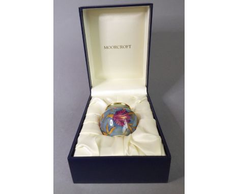 A miniature Moorcroft vase; finely hand-painted enamel fired onto copper, decorated with florid foliate designs, printed mark