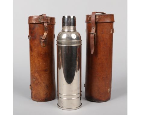 Two World War I Officers leather campaign flask cases. One containing a silver plated flask, marked to the base for The Icy-H