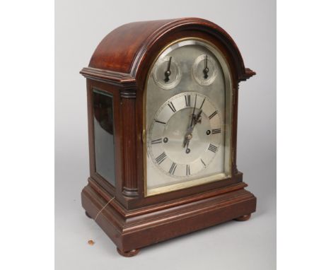 An early 20th century mahogany dome top triple fusee 8 day bracket clock by Winterhalder and Hofmeier. With silvered dial hav