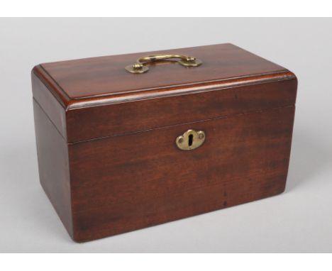 A Georgian mahogany three section tea caddy with brass handle and escutcheon, 23.5cm wide.  Good condition. With working key.