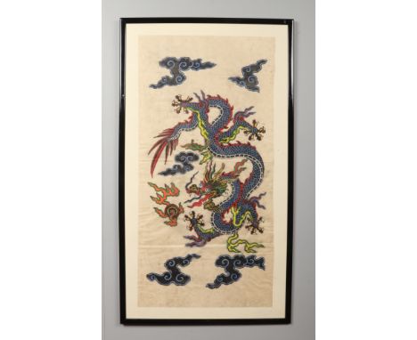 A pair of large 20th century Chinese wood block prints. Each depicting a dragon chasing a flaming pearl, 103cm x 52cm.  